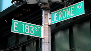 A photograph taken at the intersection of E 183rd Street and Jerome Avenue by the IRT Jerome Avenue Elevated Line That Carries the 4 trains 