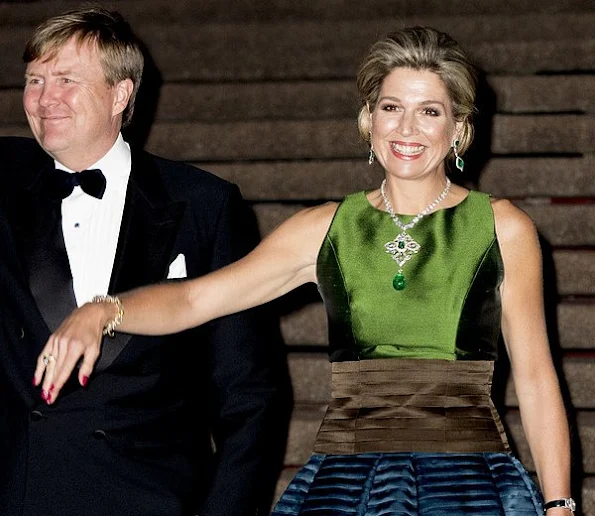 Queen Maxima diamond earrings, aqua-marine satin long dress, Natan shoes