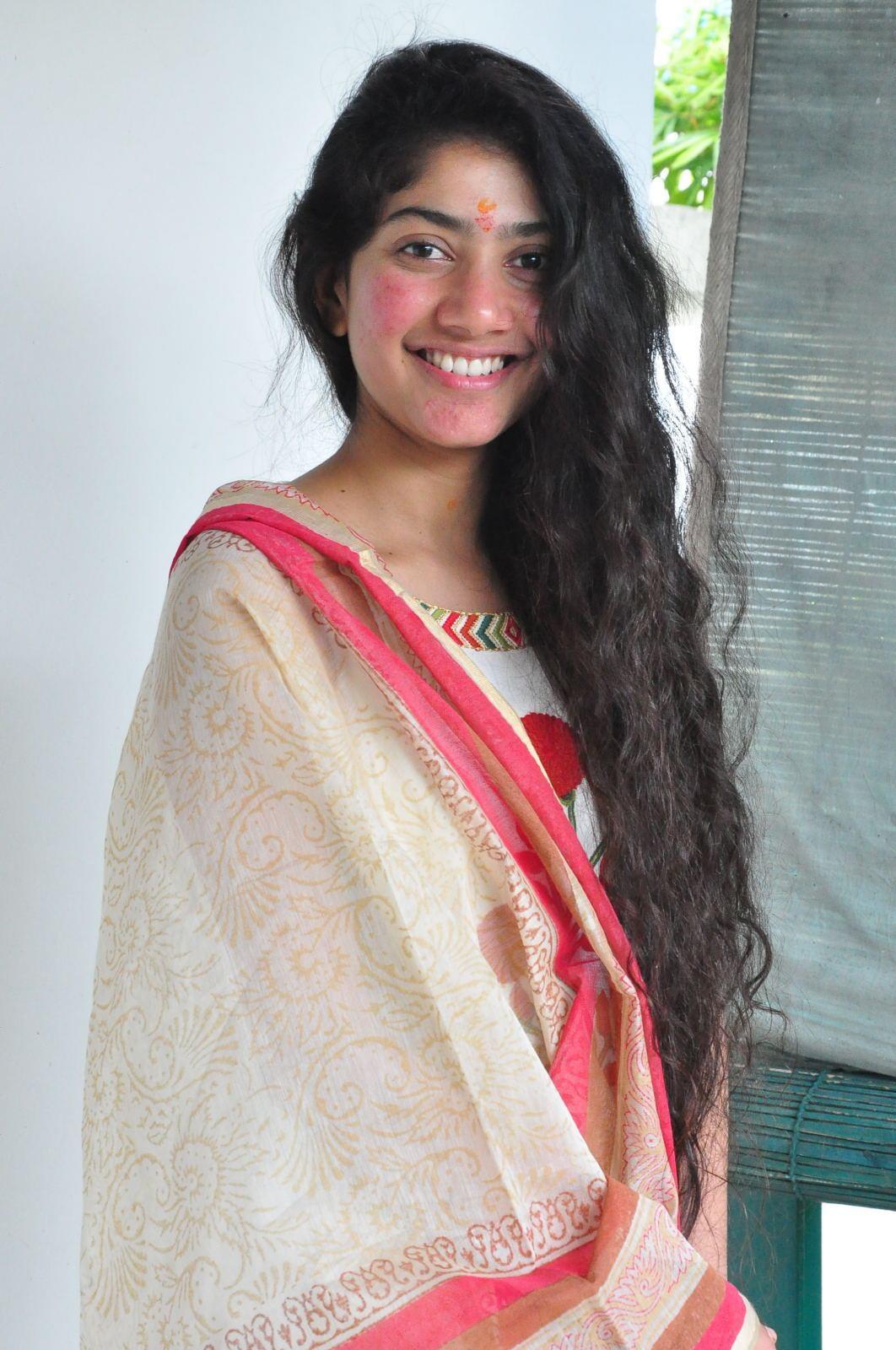 South Indian Actress Sai Pallavi Smiling Stills At Movie Launch In White Dress