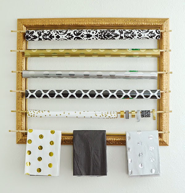 This blogger took a big frame from a thrift store and turned it into a chic gold gift wrapping organizer/station. Looks super easy and gorgeous!