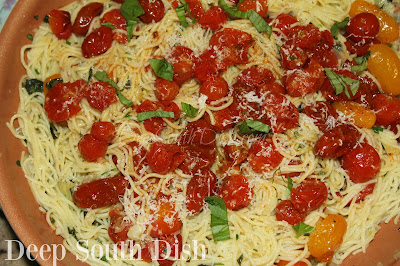 My interpretation of Aglio e Olio, spaghetti, sauteed in olive oil and garlic, tossed with fresh herbs, red pepper flakes and parmesan cheese, and finished with melted tiny tomatoes.
