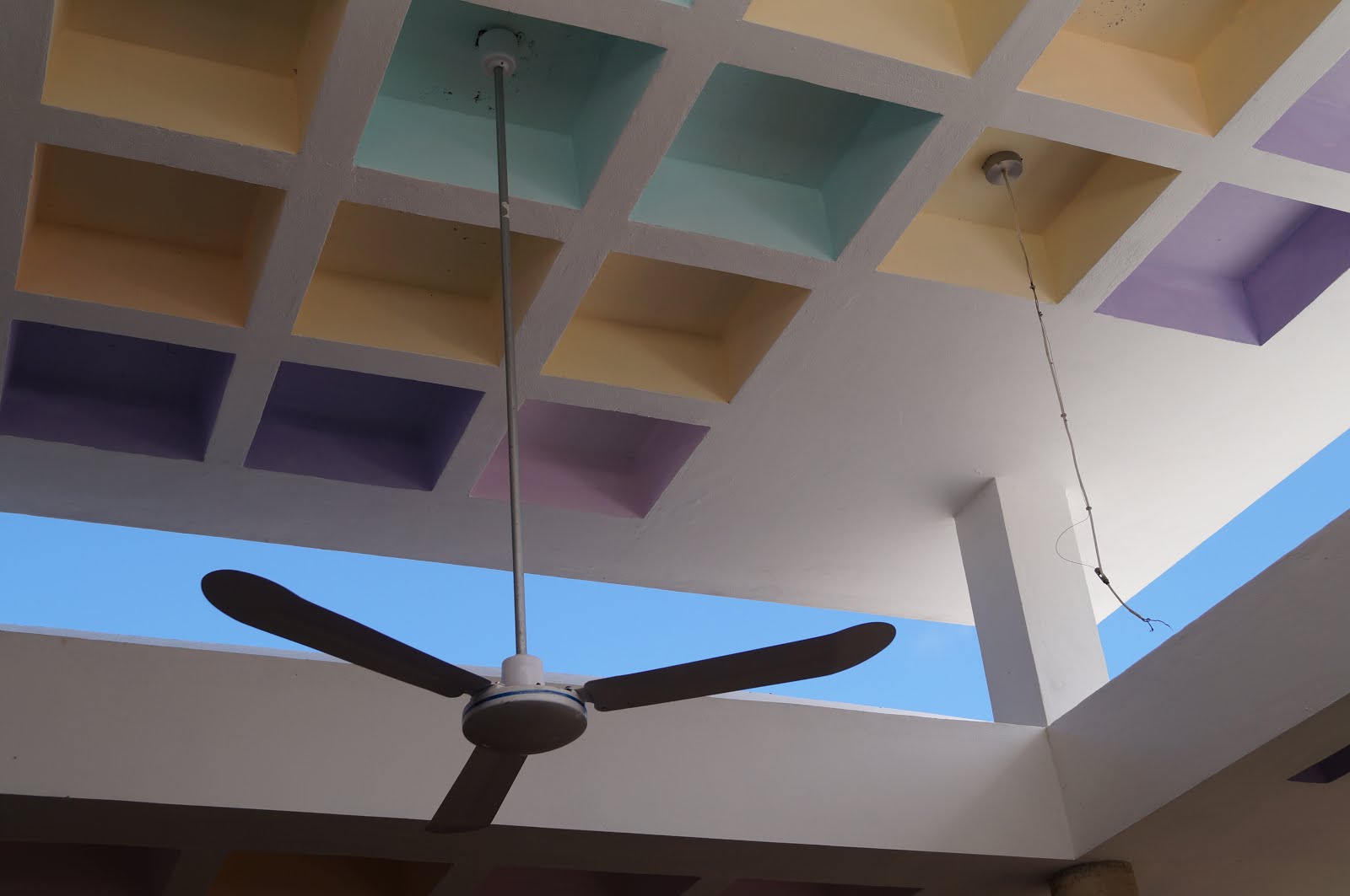 Fan against pastels and sky in Municipal Market of Cozumel