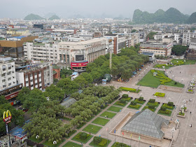 view of a Chinese city with a McDonald's