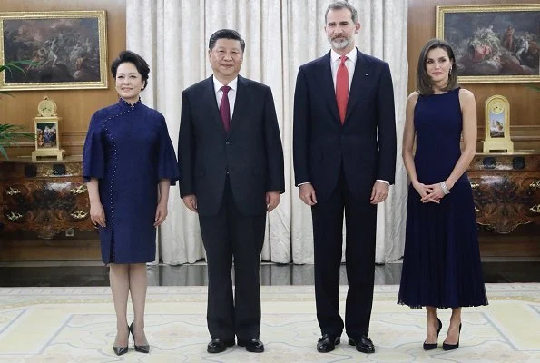 Queen Letizia wore Felipe Varela skirt and top and Nina Ricci pumps. Peng Liyuan. Queen Victoria Eugenia's Cartier diamond earrings