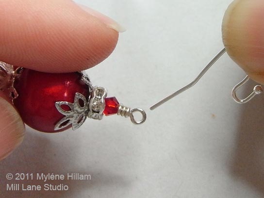 Connecting the earring to the earring wire.