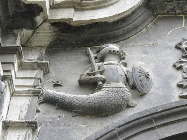 What to do in Mons Belgium in One Day: Armoured mermaid sculpture at Sainte-Elizabeth church