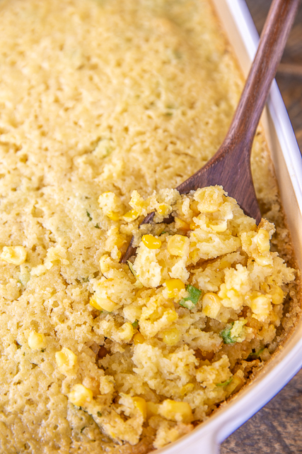 Damn Good Corn Pudding - the name says it all. This stuff is SO GOOD! I could make a meal out of this yummy side dish. SO easy to make and feeds a crowd. Flour, sugar, baking powder, salt, red pepper flakes, cumin, coriander, eggs, butter, heavy cream, green onions, creamed corn, frozen corn kernels. Perfect for cookouts, tailgates, potluck and holiday dinners. Seriously THE BEST! #corn #casserole #sideidsh #thanksgiving #christmas #potluck Damn Good Corn Pudding - the name says it all. This stuff is SO GOOD! I could make a meal out of this yummy side dish. SO easy to make and feeds a crowd. Flour, sugar, baking powder, salt, red pepper flakes, cumin, coriander, eggs, butter, heavy cream, green onions, creamed corn, frozen corn kernels. Perfect for cookouts, tailgates, potluck and holiday dinners. Seriously THE BEST! #corn #casserole #sideidsh #thanksgiving #christmas #potluck