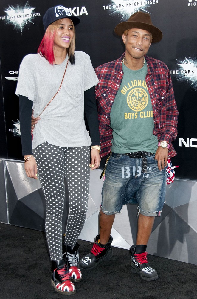 Pharrell Williams pictured with mother of his child/fiancee. 