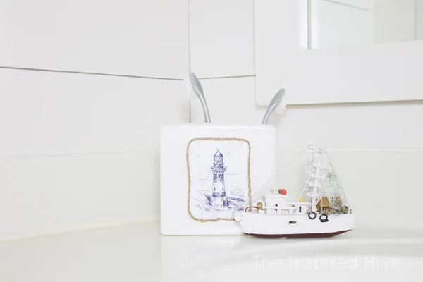 Can't find the perfect bath accessories? DIY them! Check out this nautical toothbrush holder.