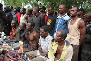 Photos: Police parade vicious gang that slaughtered 19 villagers, 2 officers in Niger State including a father and son after collecting ransom