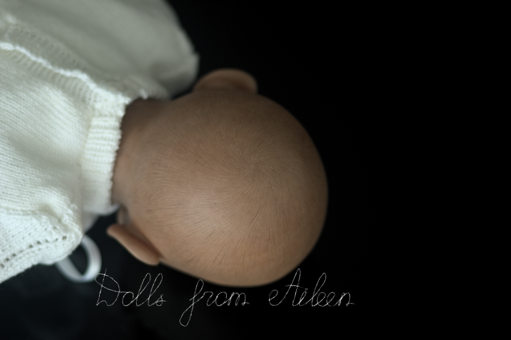 back of ooak baby doll's head showing the painted hair