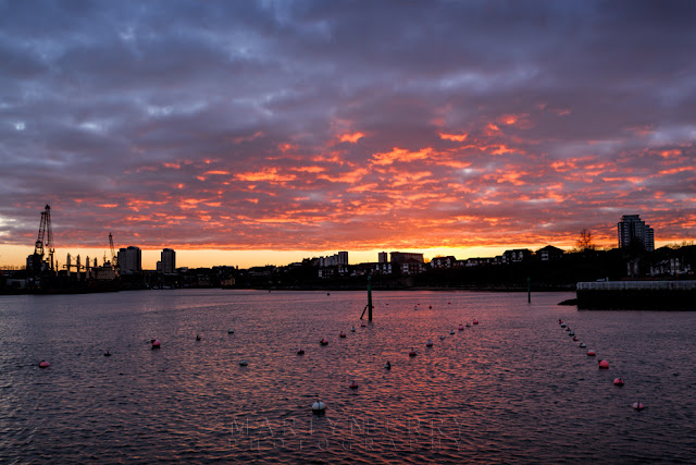 Vibrant sunset colours above the city of Sunderland from Roker