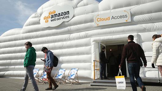 Visitors arrive at the cloud pavilion of Amazon Web Services at the 2016 CeBIT digital technology trade fair in Hanover, Germany