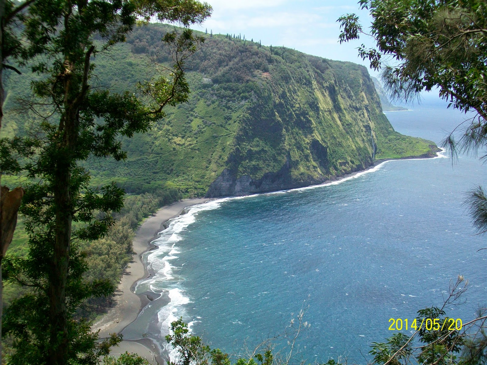 You can see one of the waterfalls on the far cliff and the river emptying into the ocean
