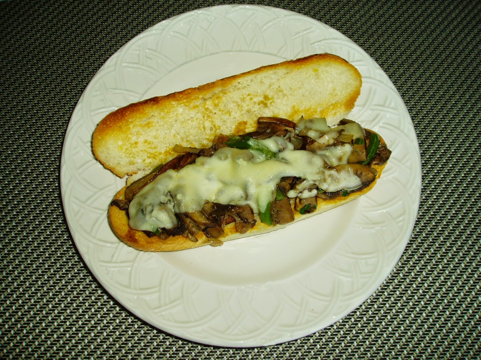 Meatless Mediterranean Portobello Cheesesteaks with Peppers and Onions