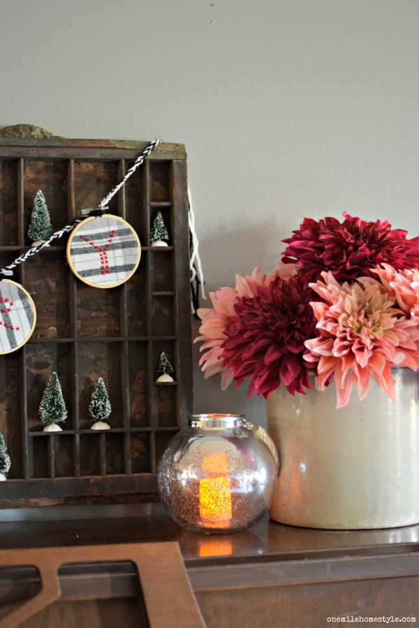 Adding pink flowers for a non-traditional accent to your Christmas decor
