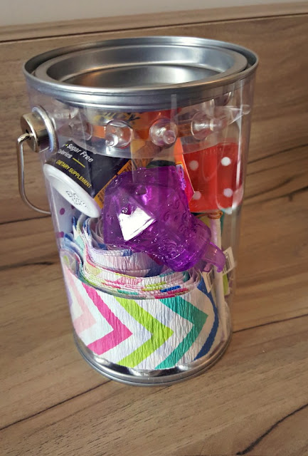 packed birthday to go container stuffed with birthday supplies