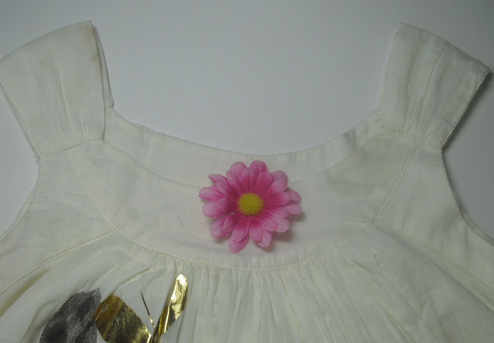 You Made That? How to Disguise a Tear in a Dress Neckline