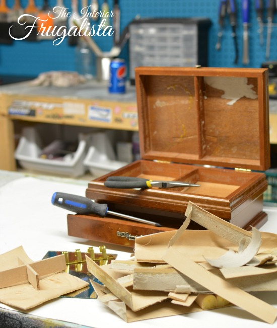 Removing felt liner inside vintage jewelry box for remote control storage.