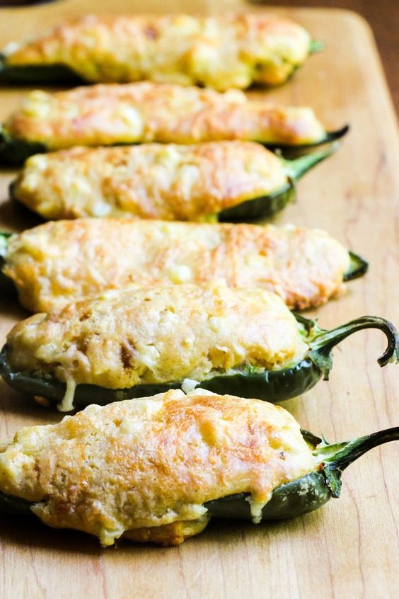 Jalapeño halves are filled with cornbread for a perfect party appetizer.