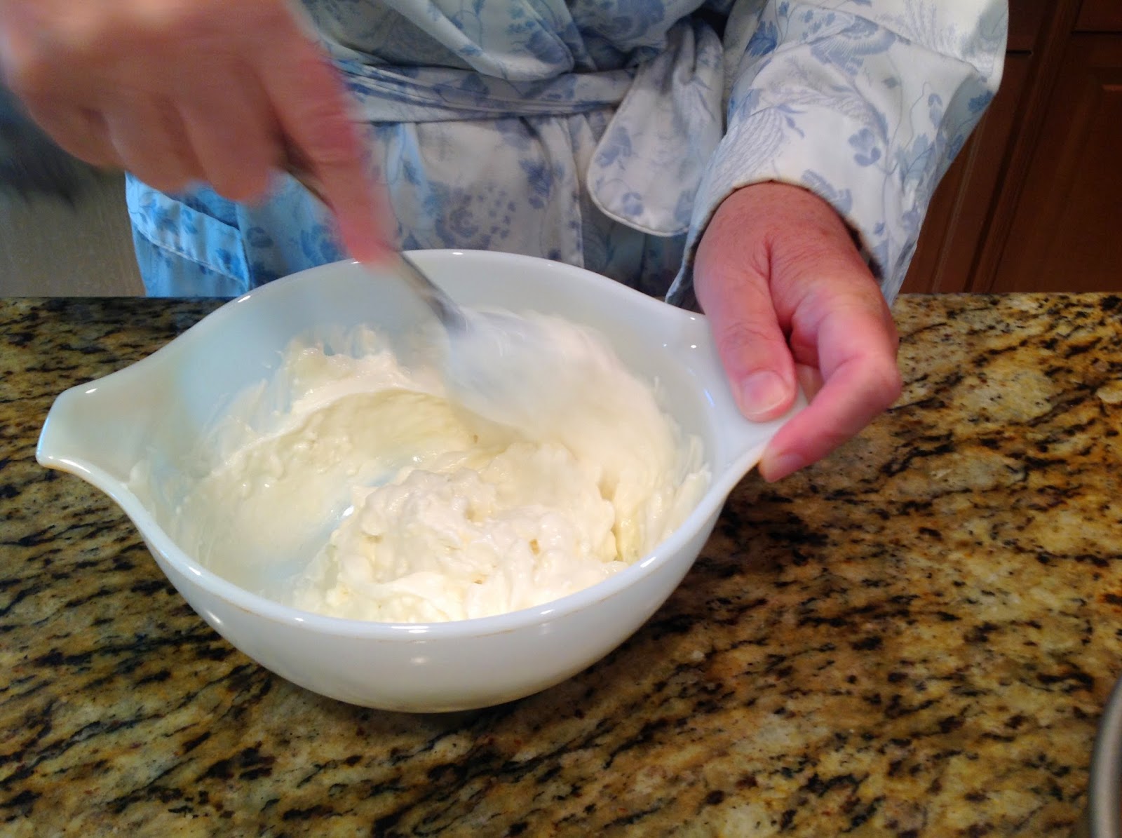 Mixing sour cream in a bowl