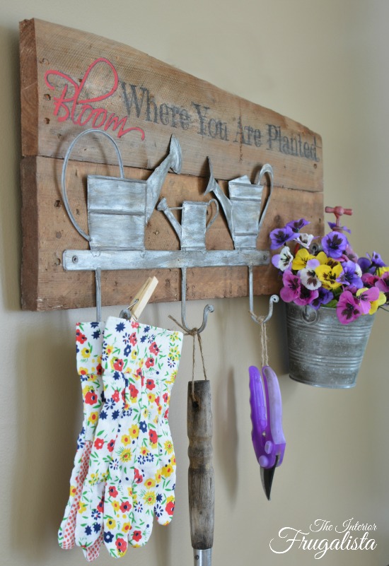 A rustic wall mount Garden Tool Holder With Flower Planter. Unique small garden tool organization for the backyard garden shed or potting bench.