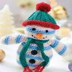 http://www.topcrochetpatterns.com/images/uploads/pattern/snowman-toy.55pdf.pdf