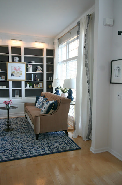 Living Room makeover with custom Ikea Billy bookcase built ins, blush velvet sofa, sherwin williams peppercorn on bookcase, sheriwin williams crushed ice on wall chic living room with picture lights Living Room makeover with custom Ikea Billy bookcase built ins, blush velvet sofa, sherwin williams peppercorn on bookcase, sheriwin williams crushed ice on wall chic living room with picture lights