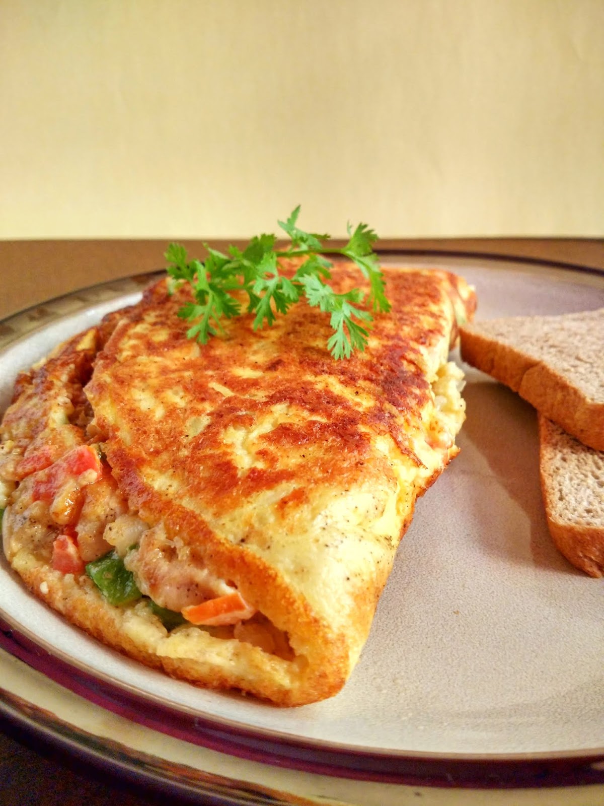 Cheesy Chicken filled Omelette Garlic Chicken Omelette Tempting Treat