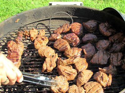 This Korean BBQ style venison backstrap is our absolute favorite way to enjoy venison. You can also use the marinade on steaks or thinly sliced beef for a more traditional take. lots of pieces of venison backstrap on charcoal grill