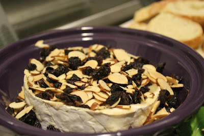 Baked Brie with toasted almonds and dried cherries