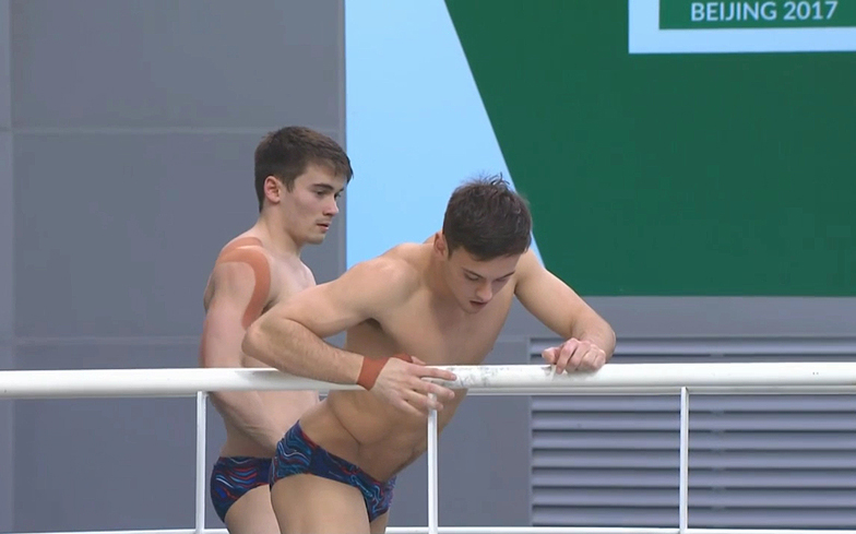 Tom Daley and Daniel Goodfellow slip into their speedos to put on a show.