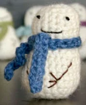 http://www.dappertoad.com/2011/12/free-mini-snowman-crochet-pattern.html