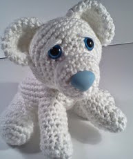 http://www.ravelry.com/patterns/library/ava-baby-polar-bear-amipal-amigurumi-stuffed-bear