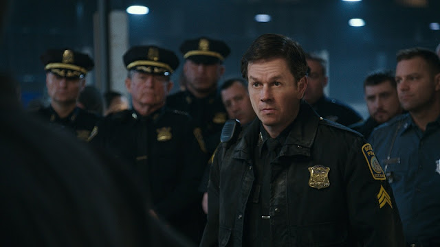 Mark Wahlberg plays a fictional Boston Policeman in PATRIOTS DAY. mark wahlberg patriots day