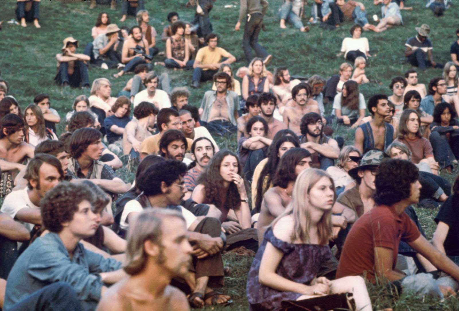 Audience members watch a performance at the Woodstock Music & Art Fair.