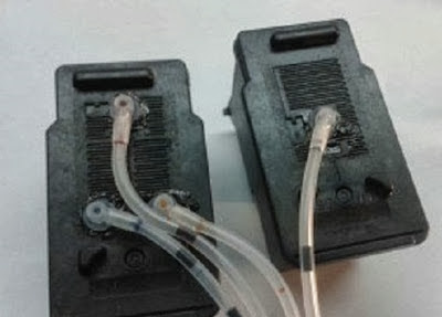 ink cartridges connected to hoses
