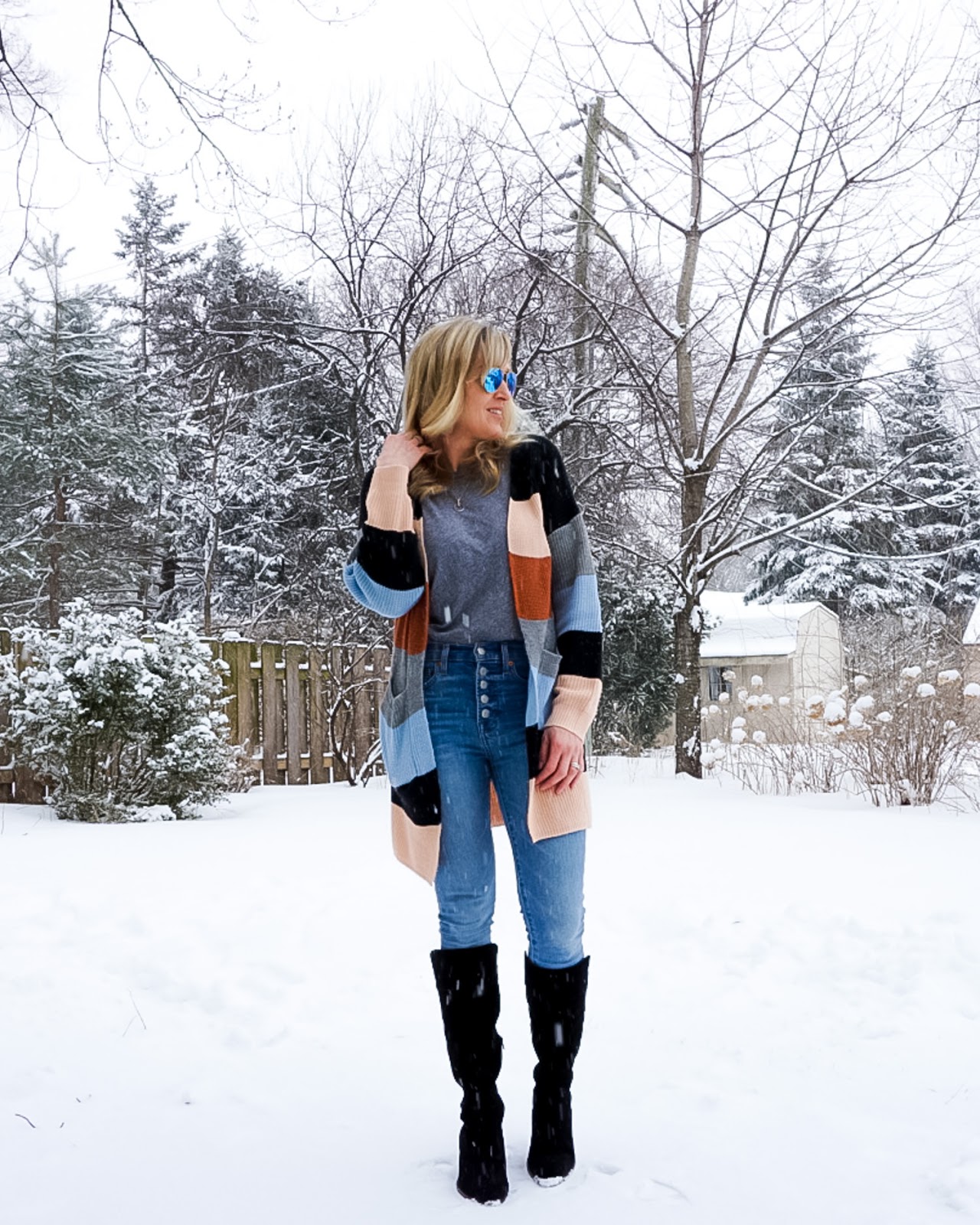 colorblock cardigan with denim and tall boots