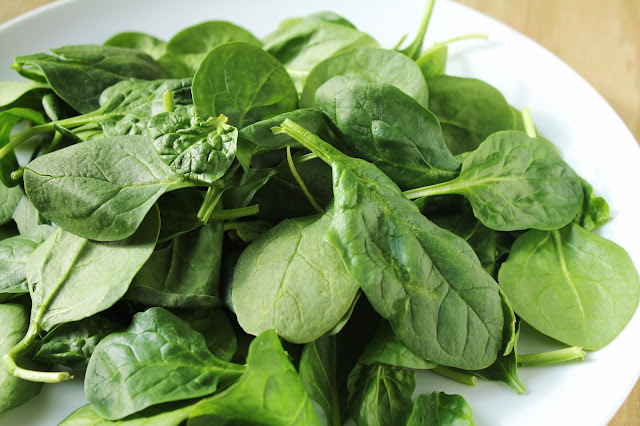 plate of baby spinach leaves