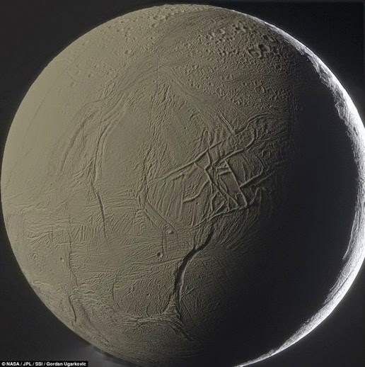 This image shows the surface of Enceladus in detail. This month is assumed to have an ocean of liquid water beneath the hard icy surface This image shows the surface of Enceladus in detail. This month is assumed to have an ocean of liquid water beneath the hard icy surface