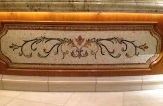 Elegant mosaics and marble tiles adorn the reception area of the Bellagio's lobby. Elegant mosaics and marble tiles adorn the reception area of the Bellagio's lobby.
