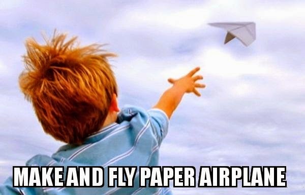 kid flying paper airplane