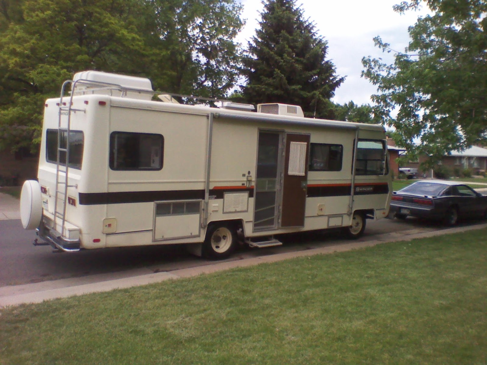 This is the motorhome parked in front of the house just after purchase 2011. Generator, both gas tank fills, power step, awning, frig vent all located on ...