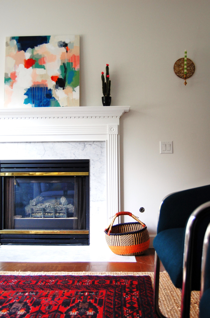 a renovated fireplace and beautiful rug