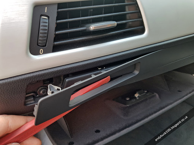 Removing cup holder trim with trim pulling tool