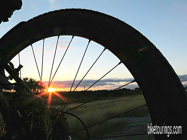 Touring Bike Wheel with Sunrise Picture of touring bike wheel with Texas Hill Country Sunrise