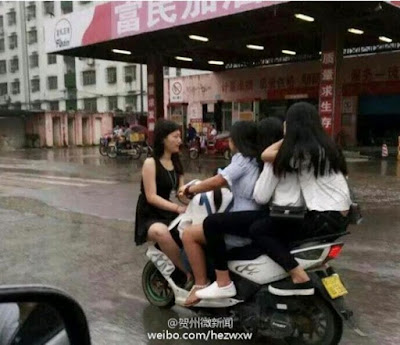 b Five ladies spotted riding one tiny bike in China