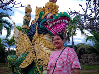Woman Traveler Stand Beside Big Dragon Statue In The Garden Yard Of Buddhist Monastery North Bali Indonesia