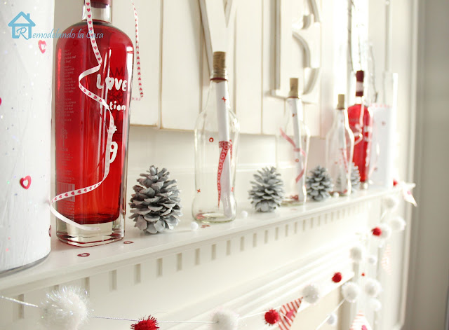 red and white valentine mantel with love potion #9 and message in a bottle