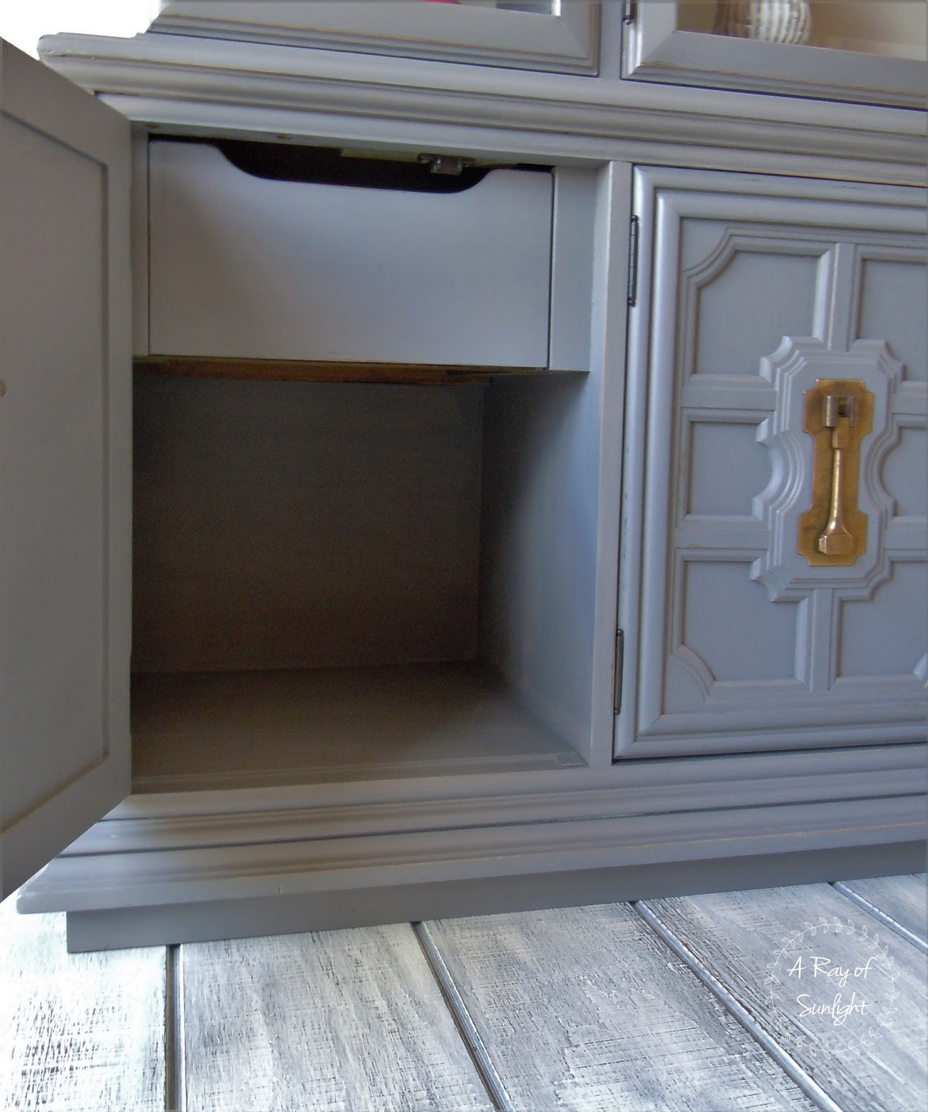 closeup of a door open on the bottom cabinet